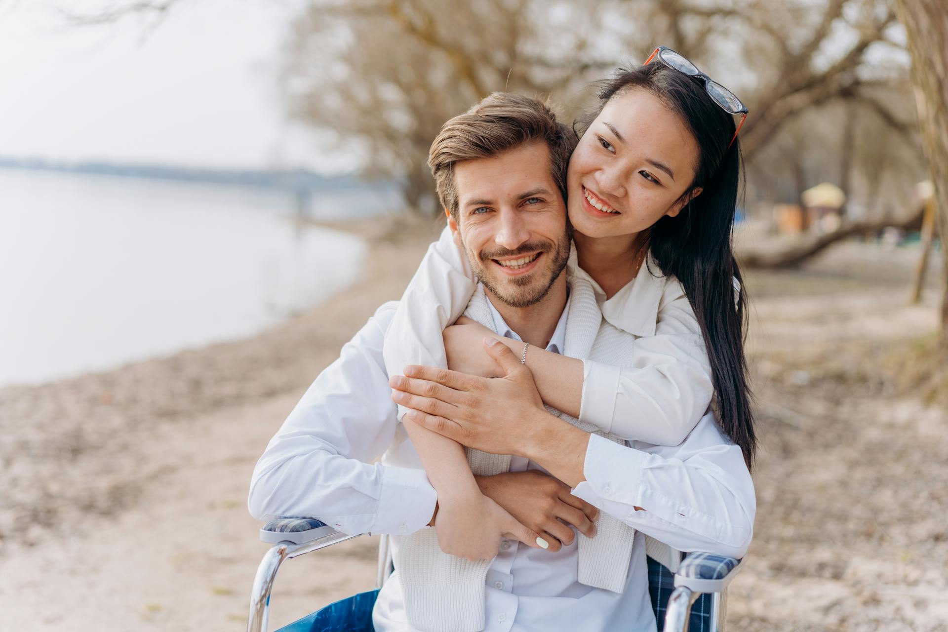 pexels-mikhail-nilov-7698550 A man and a woman embracing outdoors