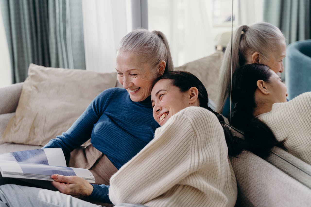pexels-cottonbro-7232037 Two women sitting close together on a sofa