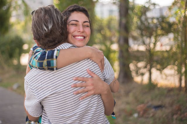 pexels-kampus-8777796 Two people embracing outdoors