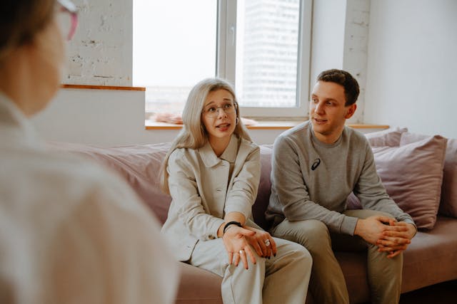 pexels-polina-zimmerman-3958379 Two people sitting on a sofa in conversation