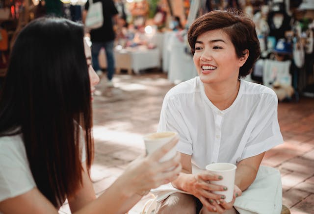 pexels-sam-lion-5709243 A woman smiling during a conversation